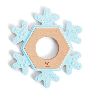 A blue silicone teether designed in the shape of a snowflake with a wooden center.