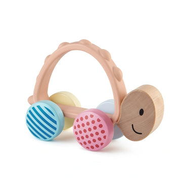 A colorful wooden turtle toy with patterned wheels and a silicone handle