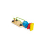 Colorful toy marble run with a blue ball on a white background
