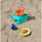 Colorful sand toys including a pot, spoon, and molds on sandy ground