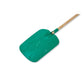 Green snow shovel with wooden handle on a white background