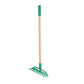 Green garden rake with wooden handle on a white background
