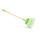 Green garden rake with wooden handle on a white background