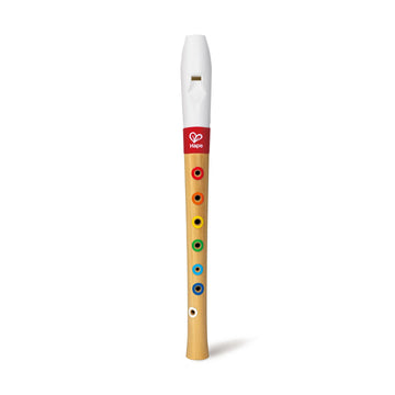 Children's wooden recorder with colorful holes on a white background