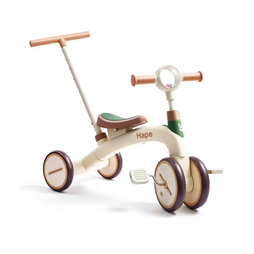 Children's tricycle with steering wheel and handlebar on a white background