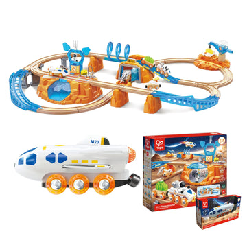 Toy train set with tracks, train, and packaging on a white background