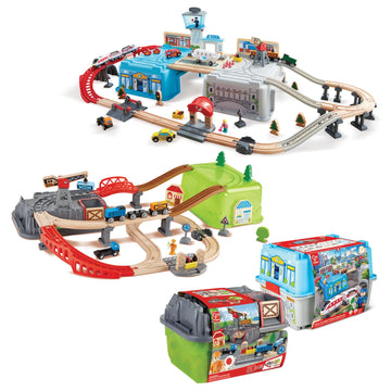 Toy train set with tracks and buildings on a white background
