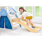Child playing on a yellow slide in a play area with a blue curtain and white walls.