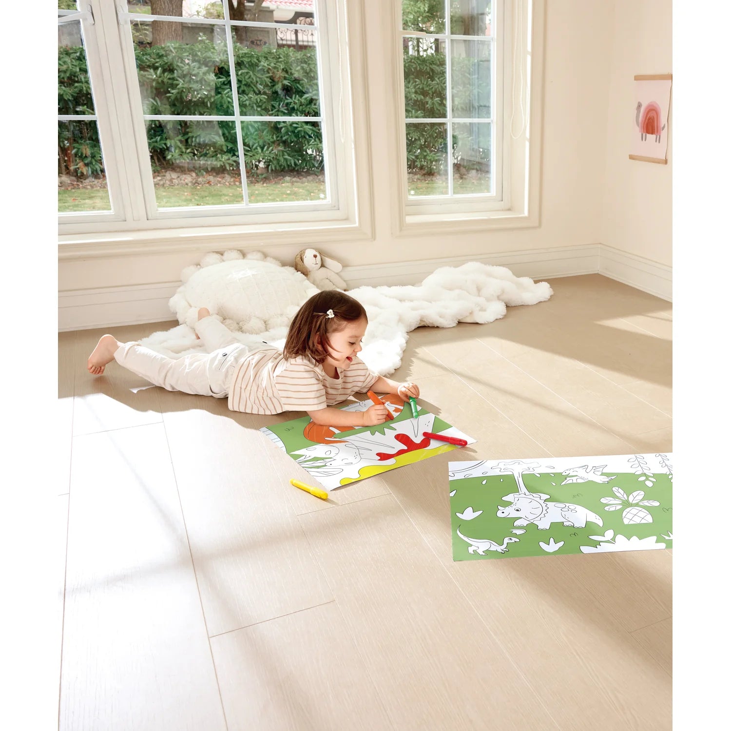 Child playing with educational mats on a carpeted floor