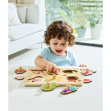 Child playing with a wooden puzzle in a bright living room.
