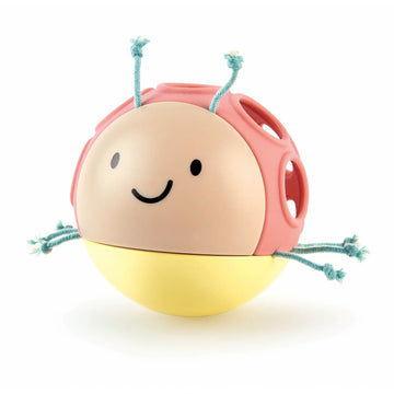 A colorful rolling toy shaped like a bug with a smiling face, six bug legs in blue, and a yellow belly with a bell.