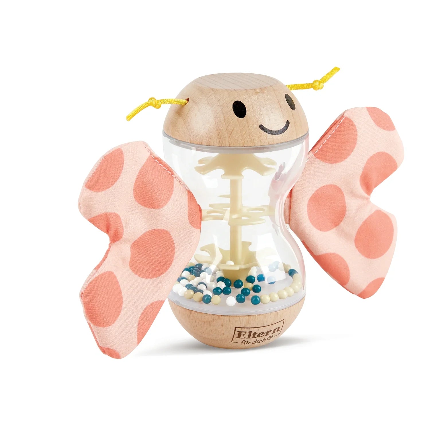 A colorful toy resembling a butterfly with wooden body and fabric wings, with beads inside the body creating a rainmaker effect.