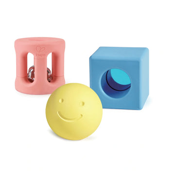 A set of three colorful geometric rattles in pink, blue, and yellow designed for babies.