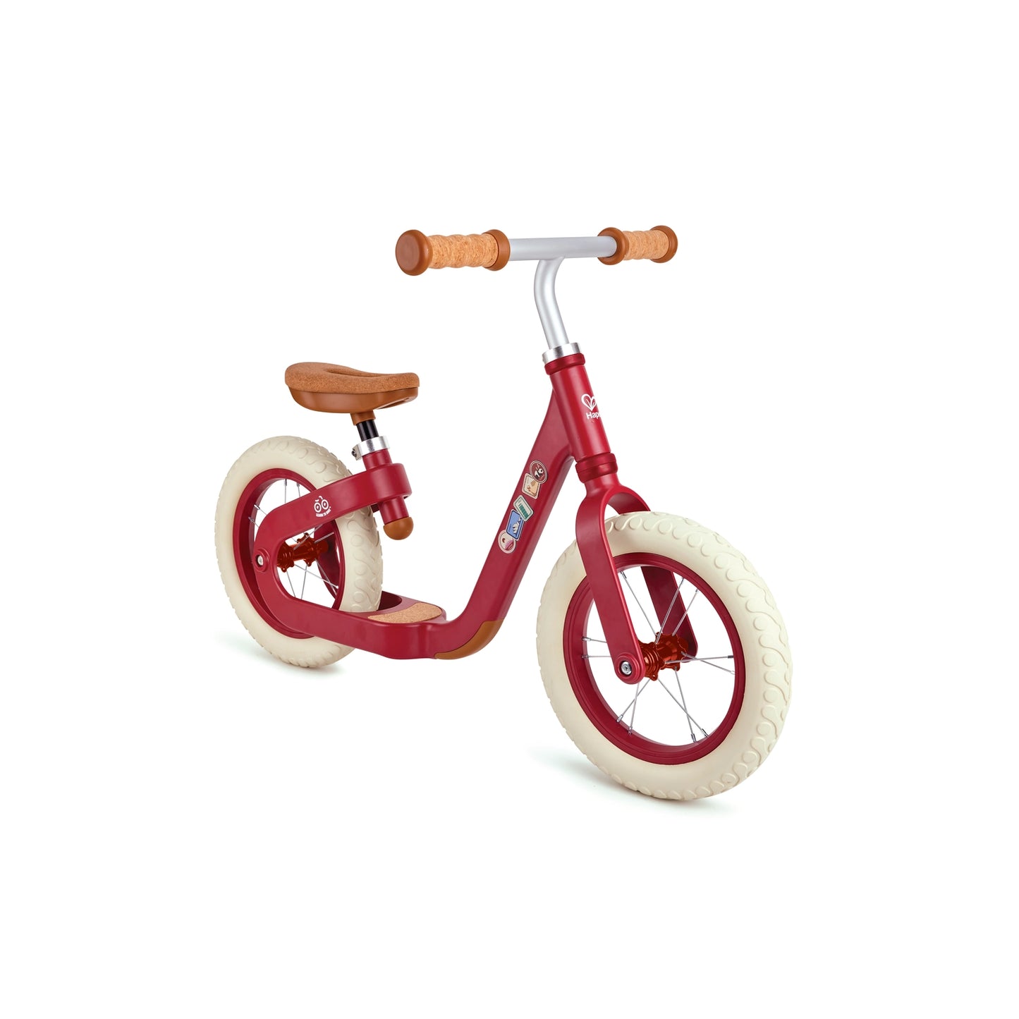 A green Hape balance bike with cork handle grips and a wooden seat, designed for young children.