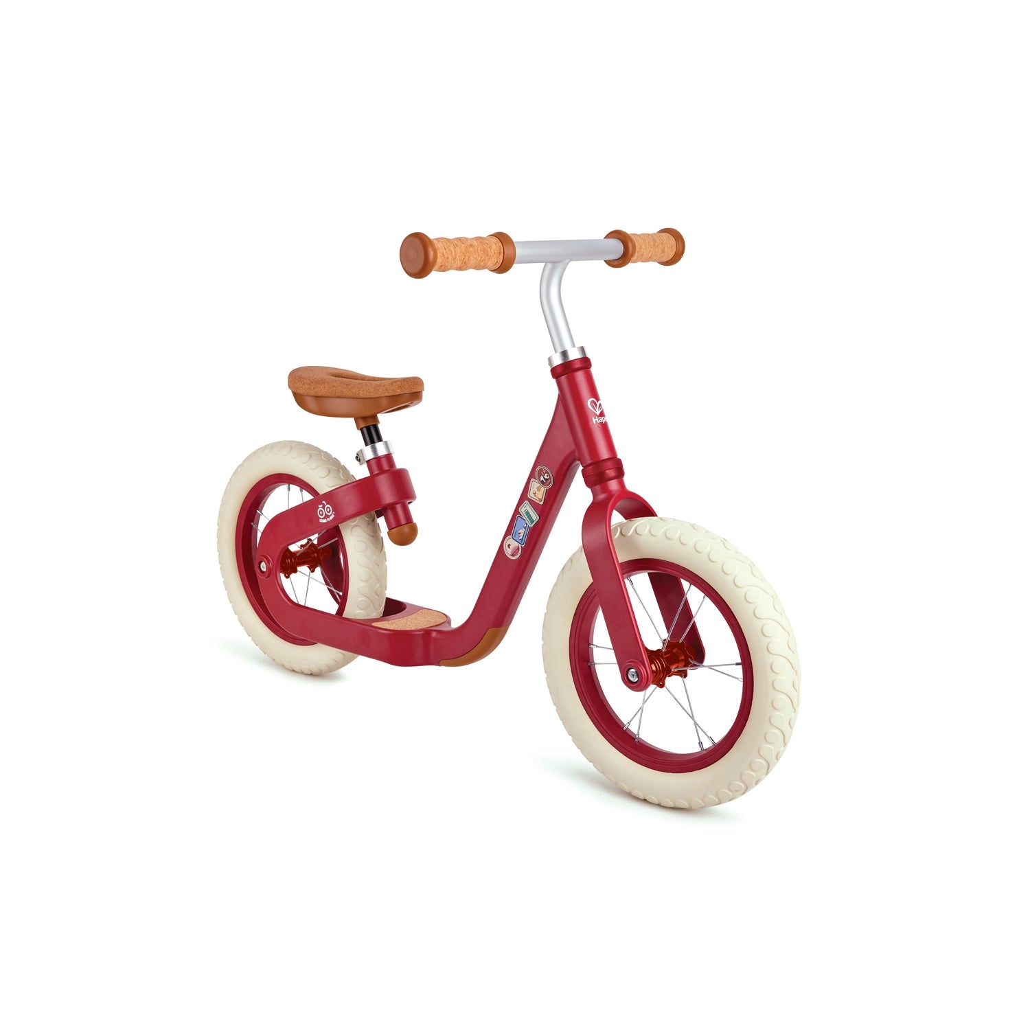 A green Hape balance bike with cork handle grips and a wooden seat, designed for young children.