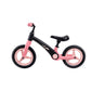 A red and black balance bike with adjustable handlebars and a saddle, suitable for young children.