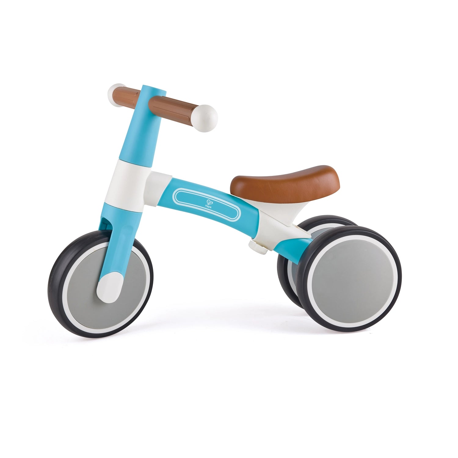 A green and white Hape balance bike with anti-slip handles and non-slip tires designed for toddlers.