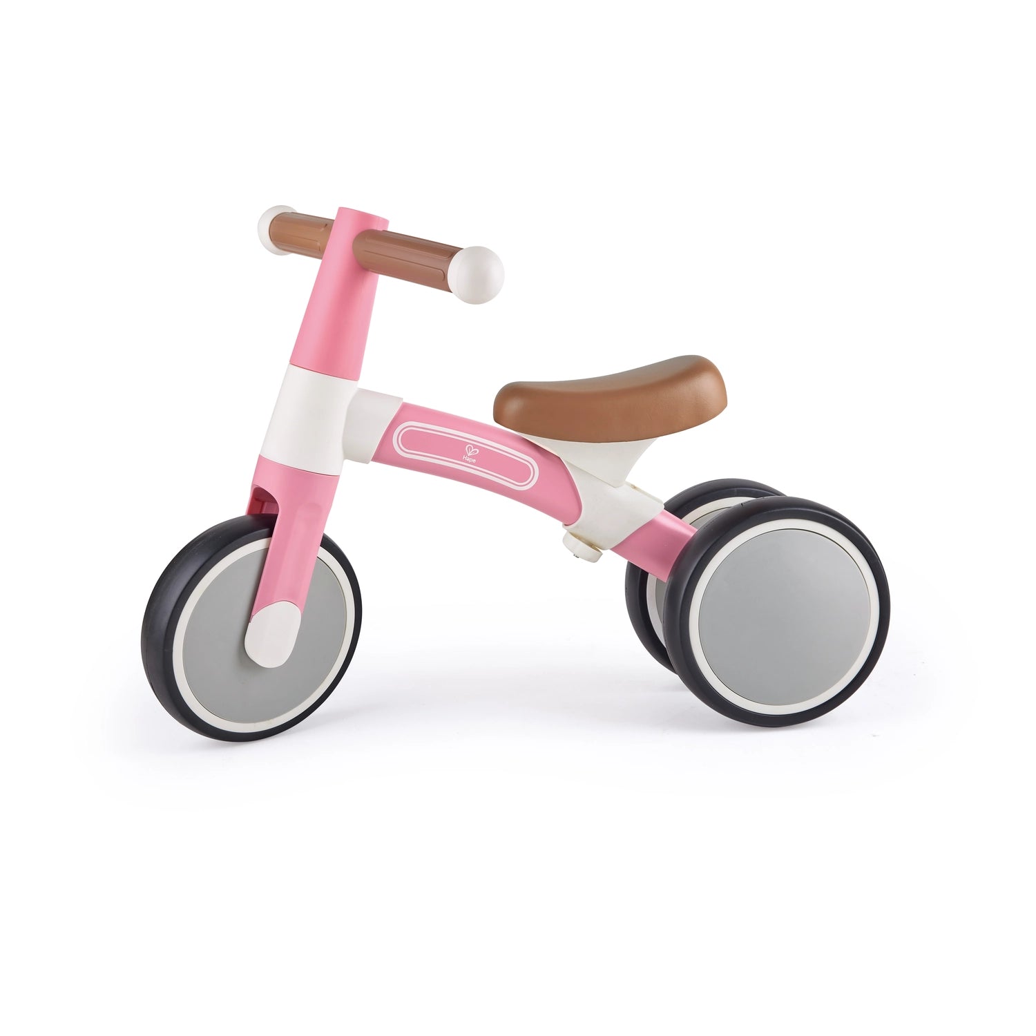 A green and white Hape balance bike with anti-slip handles and non-slip tires designed for toddlers.