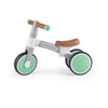 A green and white Hape balance bike with anti-slip handles and non-slip tires designed for toddlers.