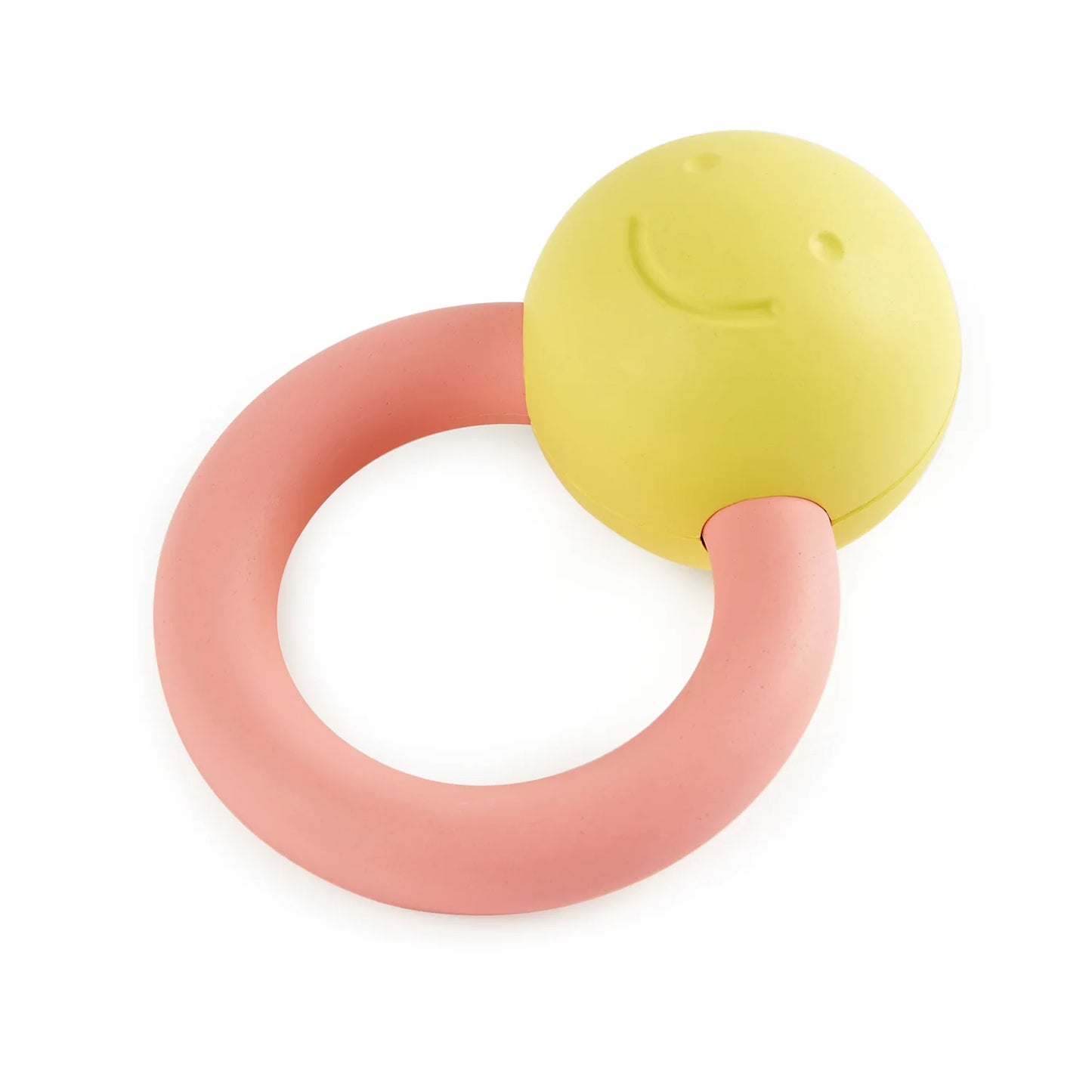 A yellow and pink ring rattle with a happy face attached to the top of the ring.