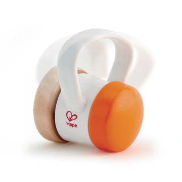 A white and orange roller rattle with a ergonomic handle designed for babies, made from wood.