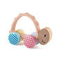 A colorful wooden turtle toy with patterned wheels and a silicone handle