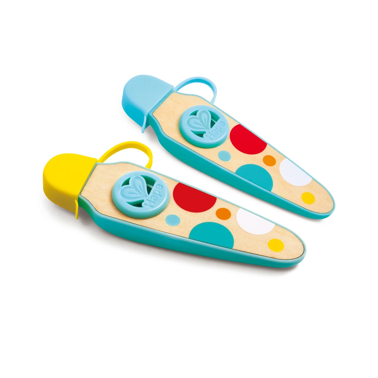 Colorful children's sandal toys with polka dot patterns on a white background