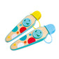 Colorful toy spatulas with polka dot design on a white background