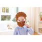 Child wearing a brown beard mask indoors