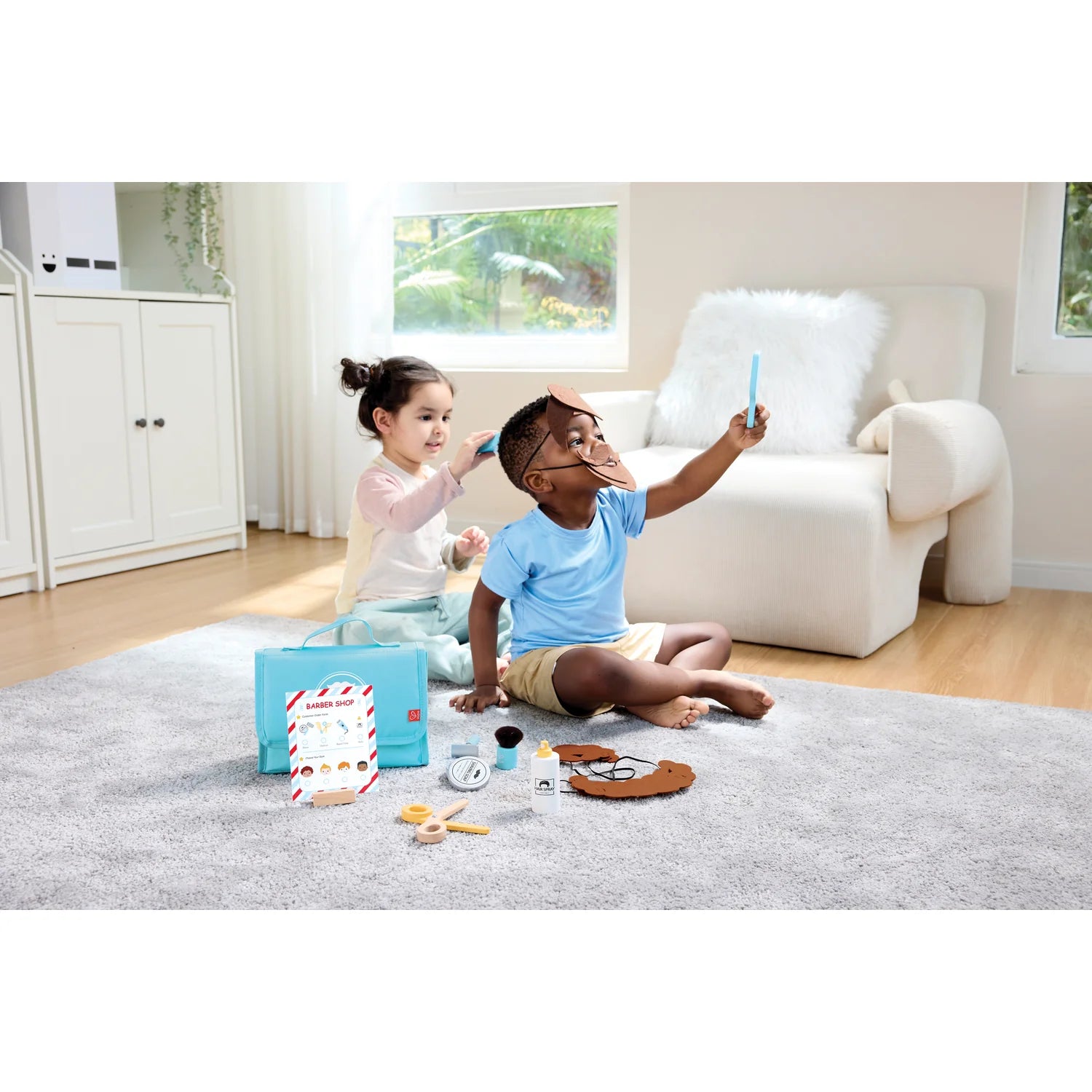 Two children playing with toys on a rug in a living room.