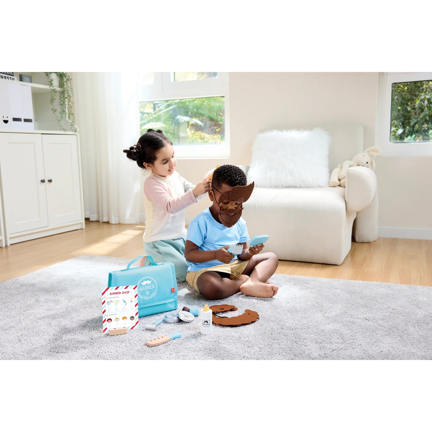 Two children playing with toys on a carpeted floor in a bright room.