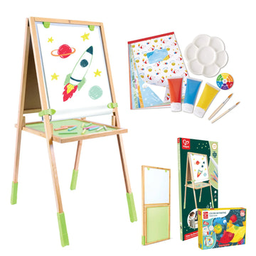 Artistic set with easel, paint supplies, and art books on a white background